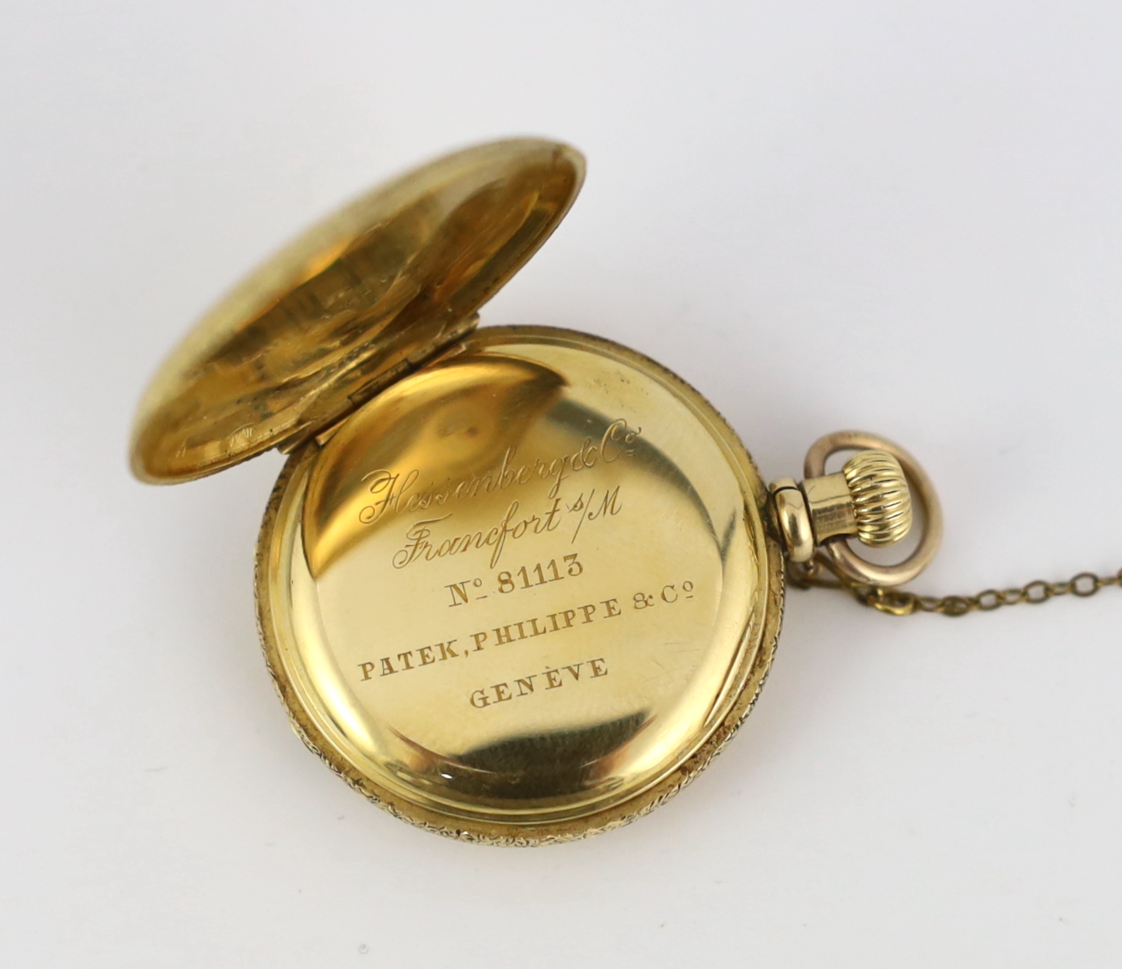 An early 20th century engraved 18ct gold and pink guilloche enamel Patek Philippe keyless fob watch